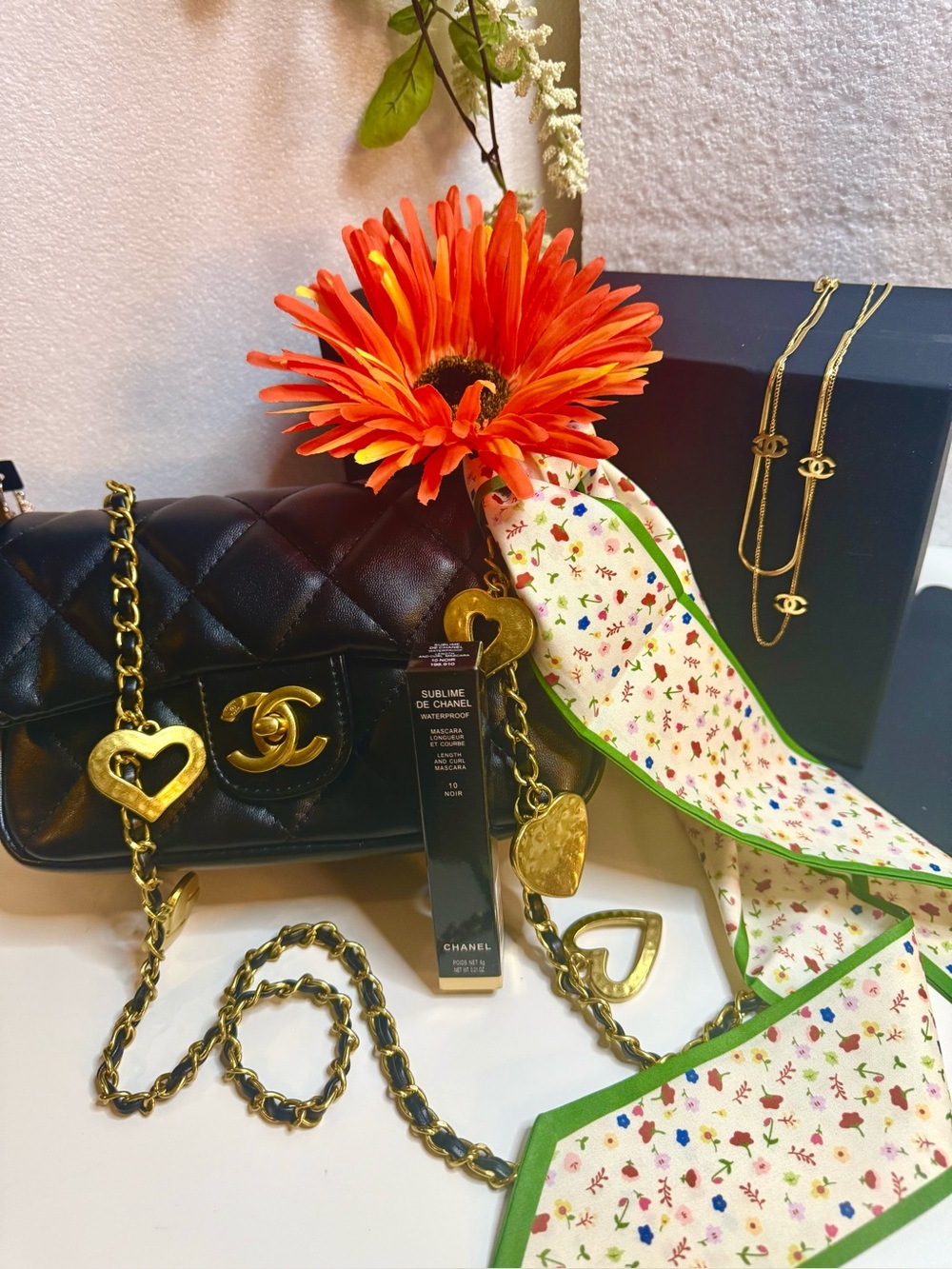 CHANEL Black Quilted Vegan Leather Crossbody with Gold Heart Charms